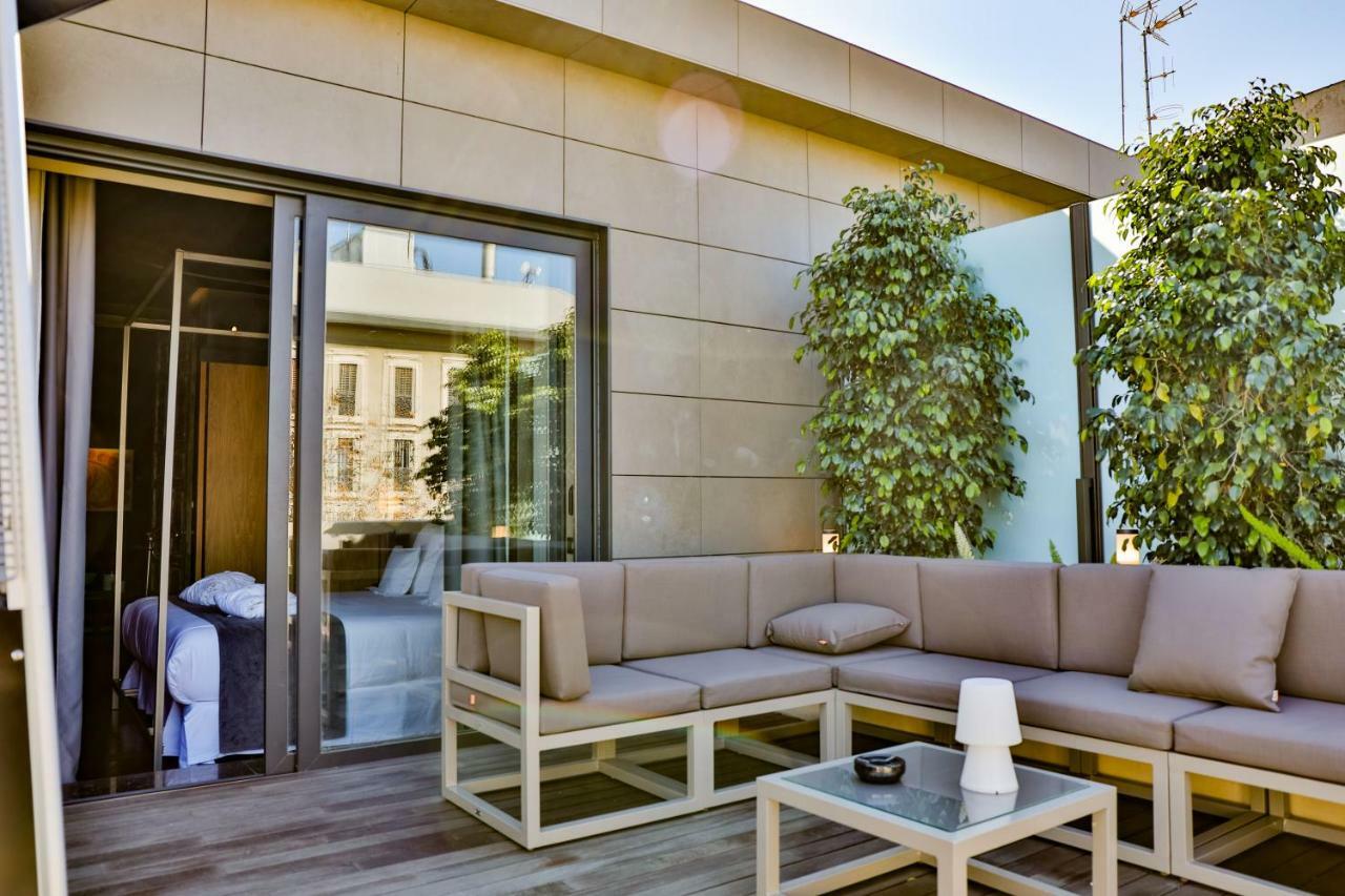 Hotel Lobby Sevilla Eksteriør bilde The hotel's rooftop