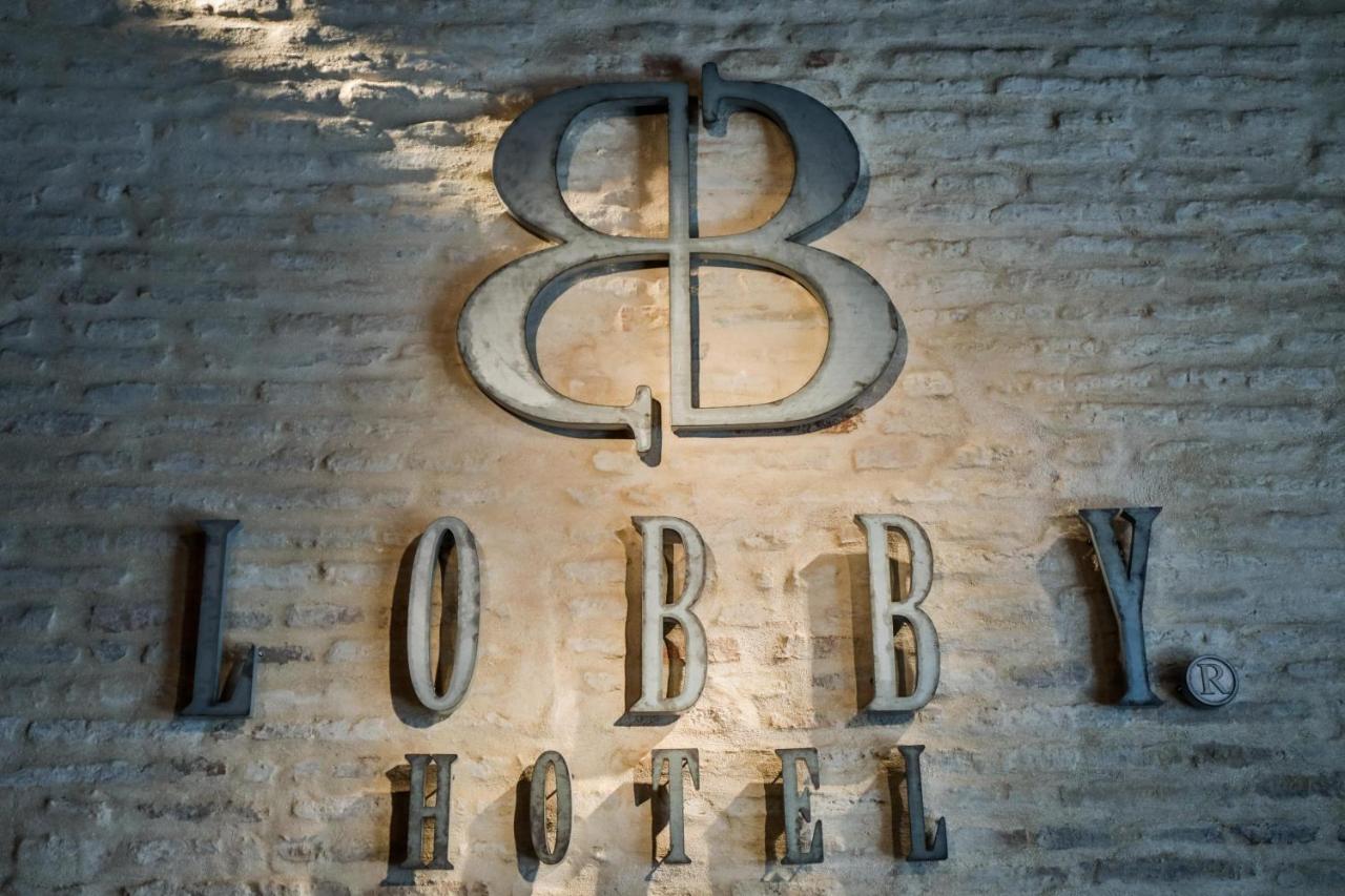 Hotel Lobby Sevilla Eksteriør bilde The logo of the 88th Fighter Group